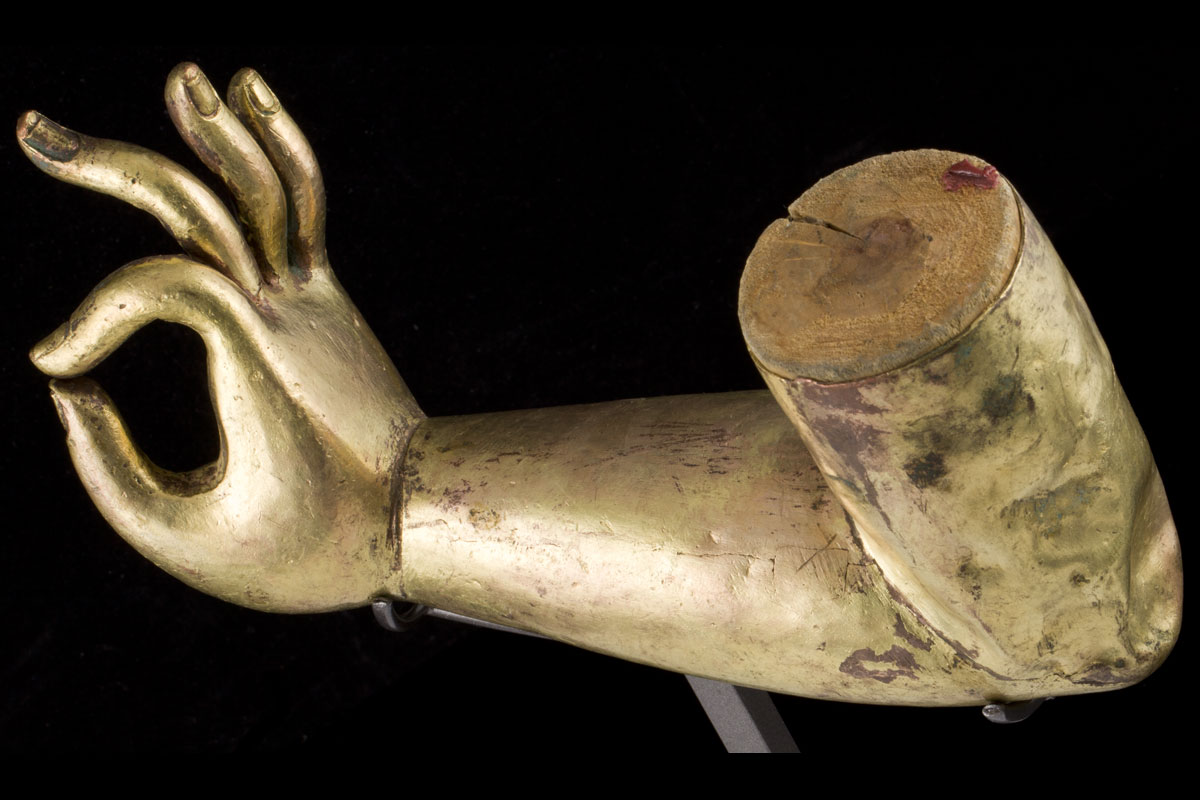 A Sino-Tibetan gilt bronze and brass arm, 16/17th century