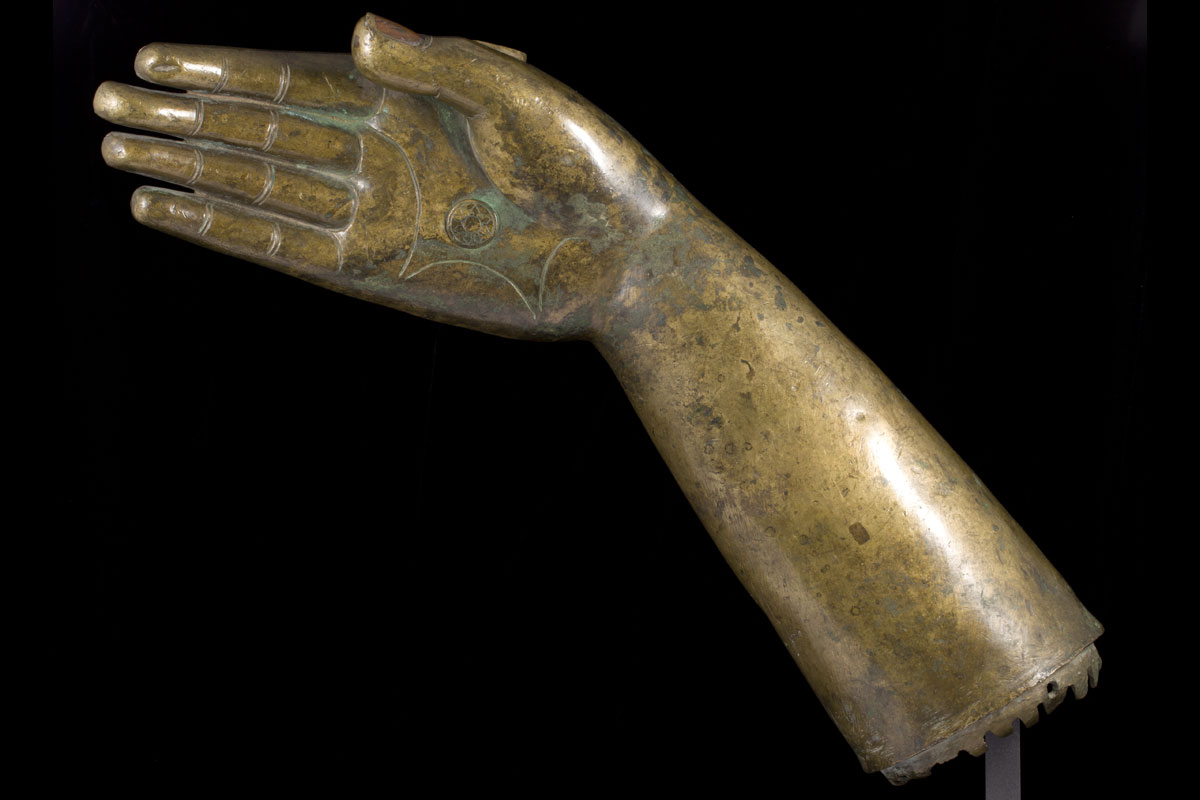 A rare large copper inlaid bronze arm, 
Tibet, Yuan Dynasty