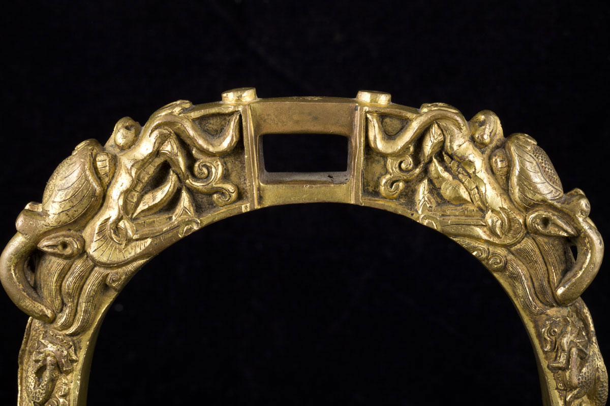 A rare pair of early Qing five clawed dragons gilt bronze stirrups