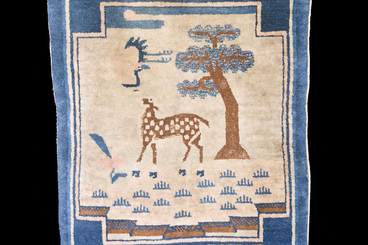Qing saddle rug with precious objects